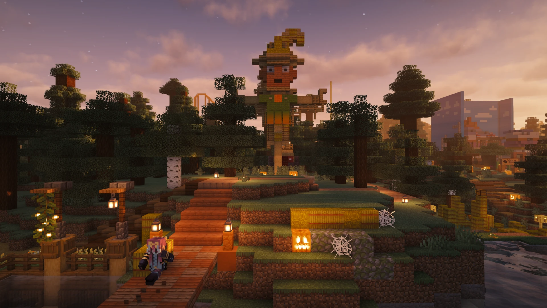 Lanterns and autumn decorations line the steps beneath a giant scarecrow at the Fall Fest entrance