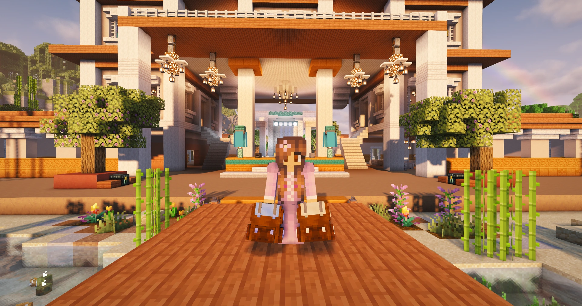 A Minecraft player with packed bags standing outside a grand, lantern-lit building in Second Haven
