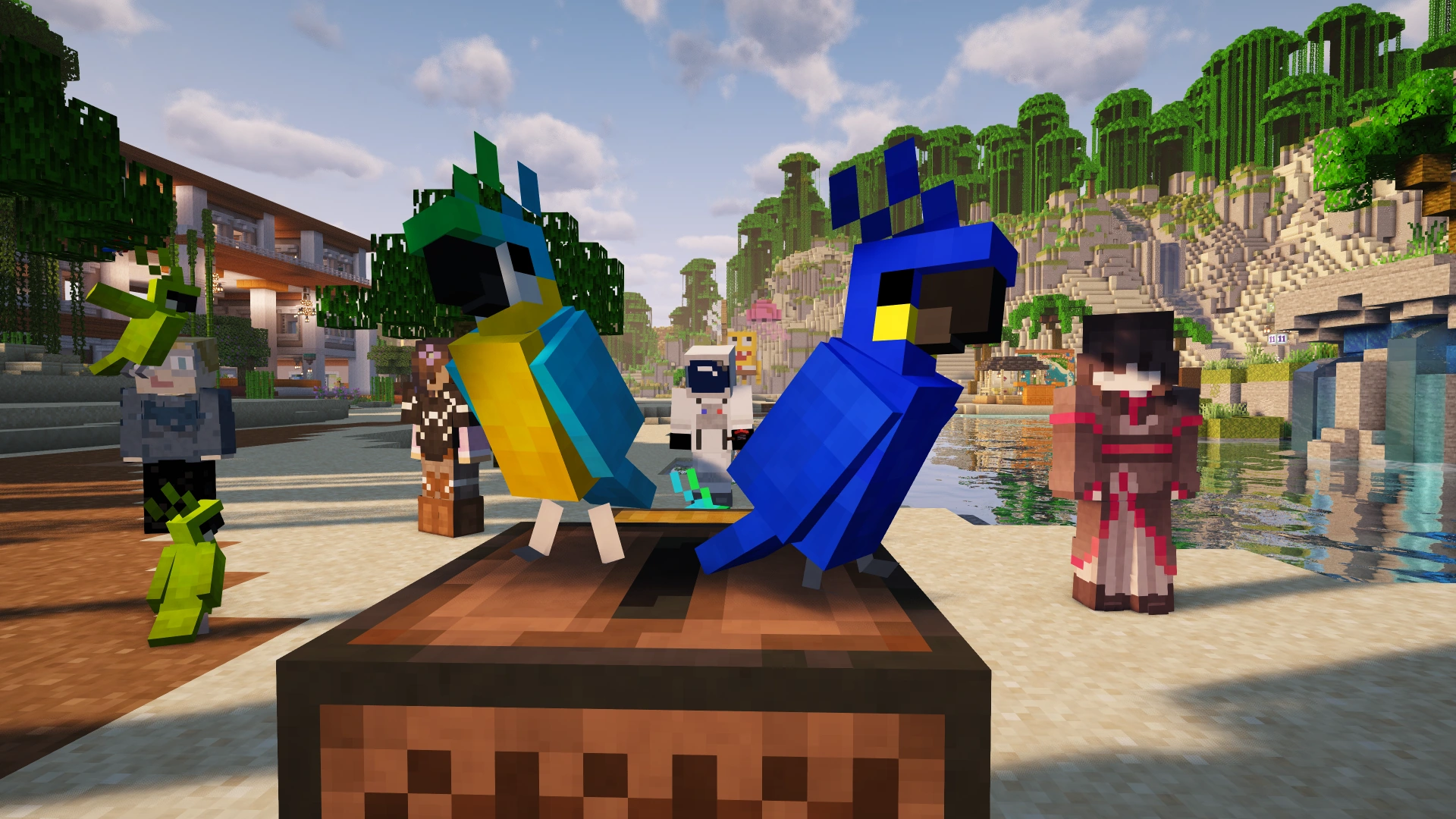 Players gathered around colorful parrots on a jukebox beside the Summer Festival waterfront
